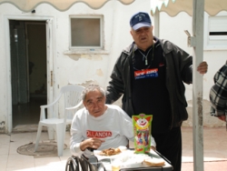 Jacques Cohen with handicapped Sderot resident 