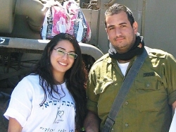 volunteer giving soldier mishloach manot