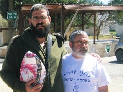 volunteer giving soldier mishloach manot