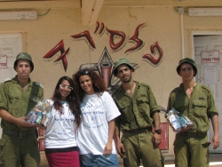Volunteers distributing packages to soldiers